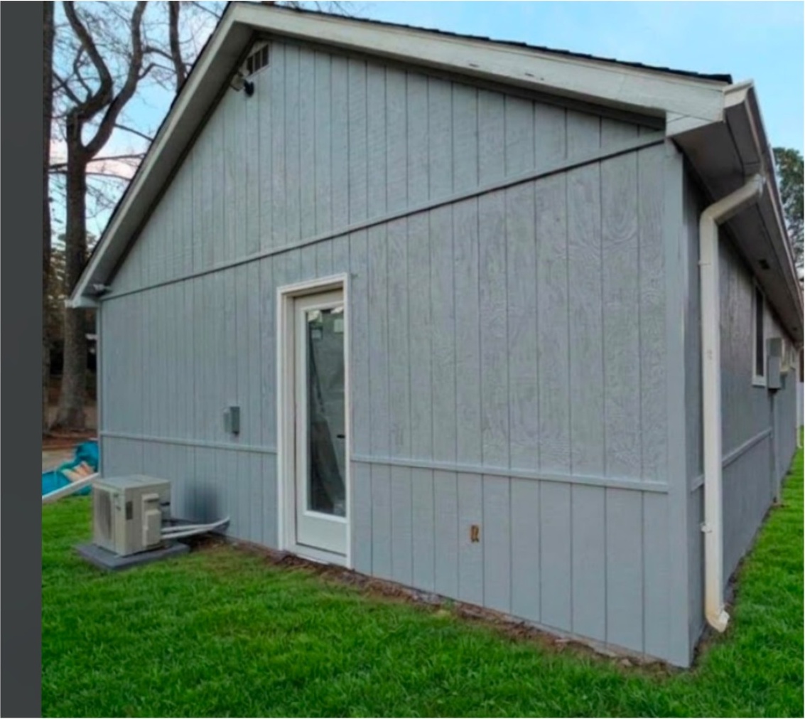 Finished side exterior with entry door